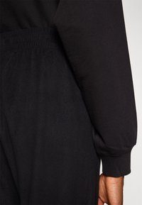 Champion ELASTIC CUFF PANTS QUICK DRY - Treniņtērpa apakšdaļas - black