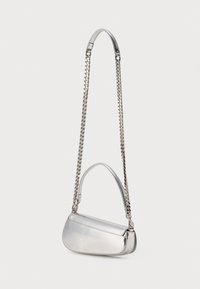 Silver metallic handbag with a curved shape, featuring a main shoulder strap and a chain accent. Smooth texture and minimal design.