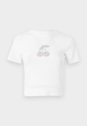 T-shirt cropped in cotone bianco con un design di ciliegie a pois in rosa e verde sul davanti. Maniche corte e scollatura rotonda.