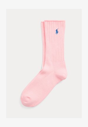 Pink ribbed crew sock with blue embroidered polo player logo on the side, displayed flat on a light background.