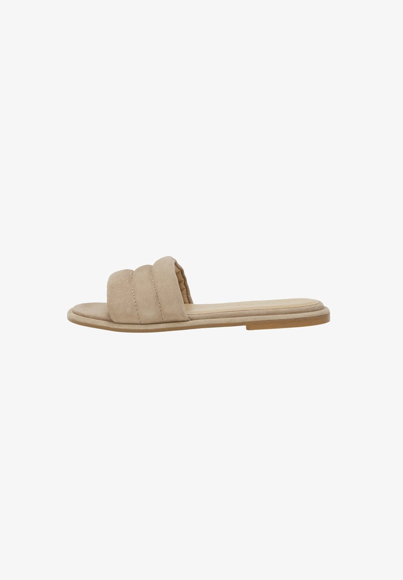 Sandale plate beige avec une large bride rembourrée et une semelle fine conçue pour une utilisation décontractée.