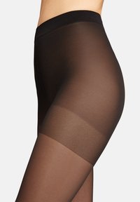Calze nere trasparenti con un motivo a nido d'ape testurizzato in vita e nella zona della coscia. Finitura liscia, materiale leggero.