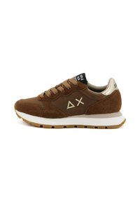 Brown suede sneakers with gold accents, white midsole, textured upper, round laces, and logo on the tongue. Moderate tread on light brown sole.