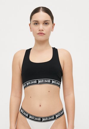 Zwarte sportbh met brede elastische band waarop het "justcavalli" logo in het wit staat. Glad oppervlak, ronde halslijn en racerback ontwerp.
