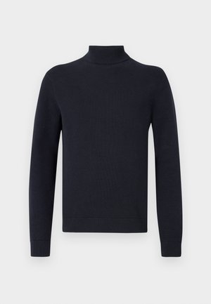 Tamsiai mėlynas golfo megztinis, pagamintas iš smulkios struktūros medžiagos, su ilgomis rankovėmis ir prigludusiomis apykaklėmis, turintis švarų, paprastą dizainą.