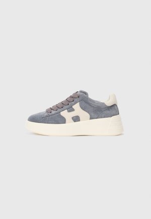 Gray suede sneaker with cream accents, thick cream sole, and matching gray laces, shown from the side on a light background.