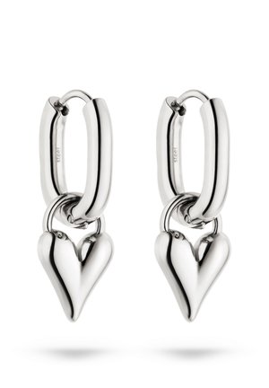 Pair of polished silver hoop earrings each with a smooth heart-shaped charm hanging from the hoop closure.