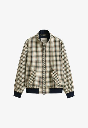 Beige jas met blauw, bruin en zwart ruitpatroon, ritssluiting aan de voorkant, schuine klepzakken met knopen en marineblauwe geribbelde manchetten en zoom.