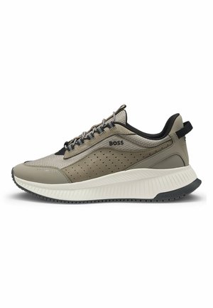 Lightweight, gray sneaker featuring a mesh upper with perforations, thick white midsole, black accents, and textured rubber sole.