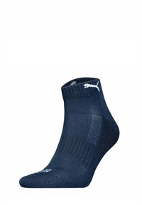 Calzini alla caviglia navy realizzati in tessuto testurizzato. Presentano un polsino a coste e un logo bianco sul lato. Progettati per comfort e traspirabilità.
