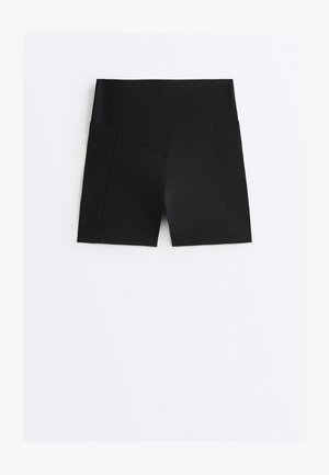 Black high-waisted athletic shorts with a wide waistband and V-shaped seam details on front legs, laid flat on a white background.