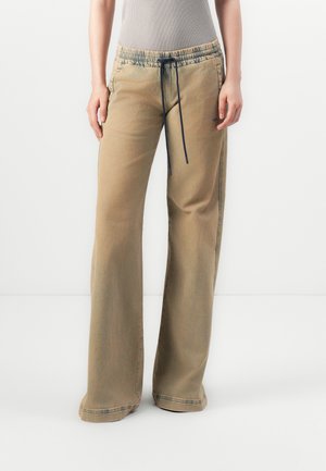 Beige wide-leg pants with a drawstring waistband and navy accents. Made from denim with a smooth texture and subtle stitching details.