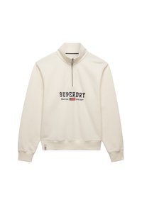 Ecru bluza z zamkiem do ćwiartki, z napisem „SUPERDRY NEW YORK ATHL DEPT” i małym logo flagi na piersi, z prążkowanymi ściągaczami przy rękawach i u dołu.