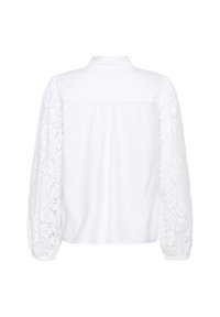 White blouse featuring long puff sleeves made of embroidered lace. The back has a plain design with a straight cut and subtle pleat detail.