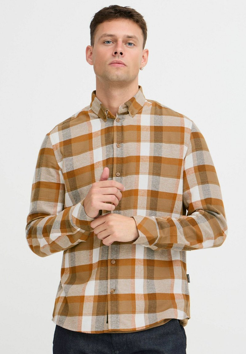 Kariertes Hemd in den Farbtönen Orange, Beige und Grau. Mit Kragen, langen Ärmeln und abgerundetem Saum.