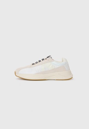 Sneakers with a beige suede and iridescent fabric upper, black laces, and a chunky light beige sole. Accented with a textured finish.