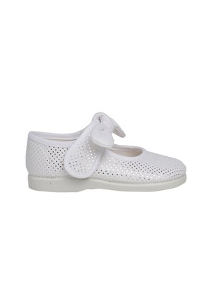 White perforated shoe with a round toe, flat sole, and a soft bow strap detail. Made of flexible material for comfort and breathability.