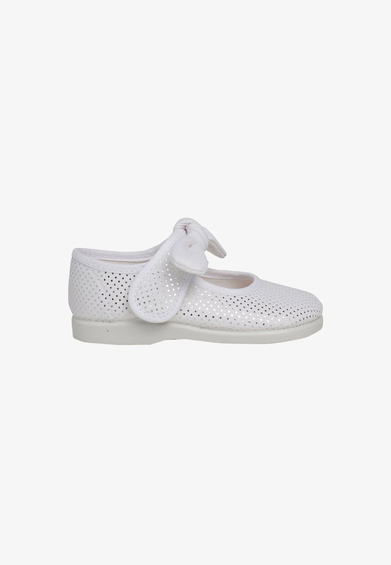 White perforated shoe with a round toe, flat sole, and a soft bow strap detail. Made of flexible material for comfort and breathability.