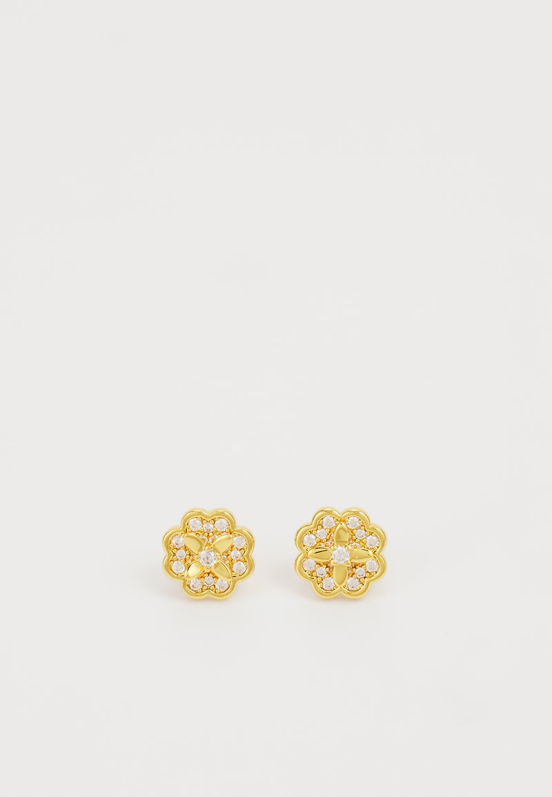 Orecchini a chiodo in tonalità oro con design floreale, caratterizzati da pietre incassate trasparenti. La texture è liscia, con una finitura lucida e bordi arrotondati.