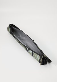 Green and black camouflage bag with a smooth interior, zip closure, and a single carrying strap on one side. Rectangular shape.