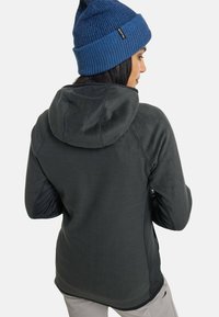 Fleece hoodie in dark gray with a soft texture and a fitted silhouette. Features a hood, contrasting dark sleeves, and a rounded hem.