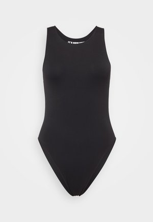 Mustmustel mustükk, millel on kõrge kaelus, ilma varrukateta disain ja sile kangas. Taga on madal lõige ja õmblusteta ehitus.