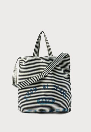 Sac fourre-tout en coton rayé bleu marine et crème, doté de deux poignées robustes et d'un texte bleu en détail. Design spacieux avec une texture douce.
