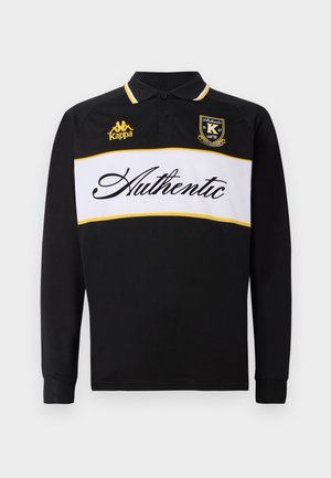 Polo a maniche lunghe nero con strisce orizzontali bianche e gialle, testo "Authentic", logo Kappa e colletto classico.
