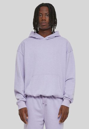 Lilac hoodie made of soft fabric, featuring a kangaroo pocket, a V-neck hood, and relaxed fit with dropped shoulders.