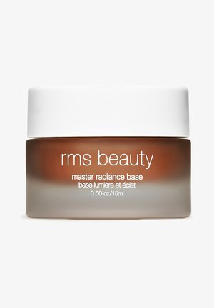 RMS Beauty Master Radiance Base in een glazen pot met een witte deksel. De pot is bruin getint met een matte afwerking, duidelijk gelabeld in het wit.