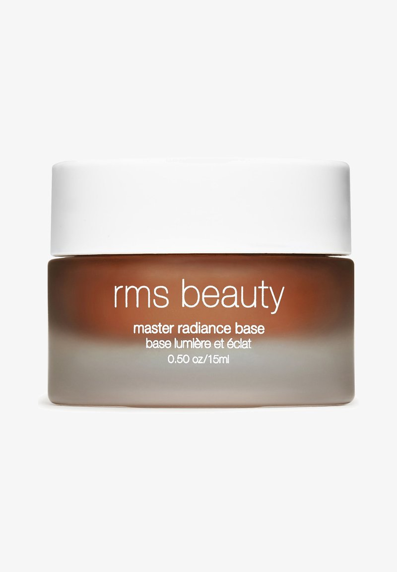 RMS Beauty Master Radiance Base in een glazen pot met een witte deksel. De pot is bruin getint met een matte afwerking, duidelijk gelabeld in het wit.