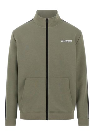 Sudadera verde oliva con cremallera, hecha de mezcla de algodón. Cuenta con un cuello alzado, dos bolsillos frontales y franjas negras contrastantes en las mangas.
