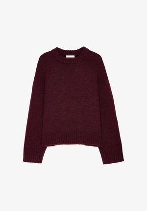 Bordeaux strikket sweater med ribbet rund hals og manchetter. Har en afslappet pasform og sænkede skuldre, med en let cropped kant.