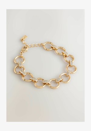 Pulsera de cadena dorada con eslabones circulares entrelazados y acentos claros y brillantes. Incluye un cierre y longitud ajustable.