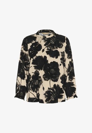 Bežava bluzica dugih rukava s velikim crnim cvjetnim uzorkom, visokim ovratnikom i ukrasnim bisernim gumbima na prednjem volanu.
