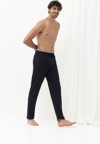 Donkerblauwe loungebroeken gemaakt van zachte stof, met een elastische tailleband met een trekkoord, en een comfortabele pasvorm.