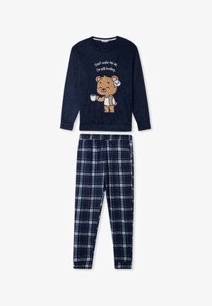 Maglia da pigiama a maniche lunghe blu con grafica di un orso e testo; pantaloni a quadretti blu e bianchi. Materiale morbido, vestibilità comoda, vita elastica.