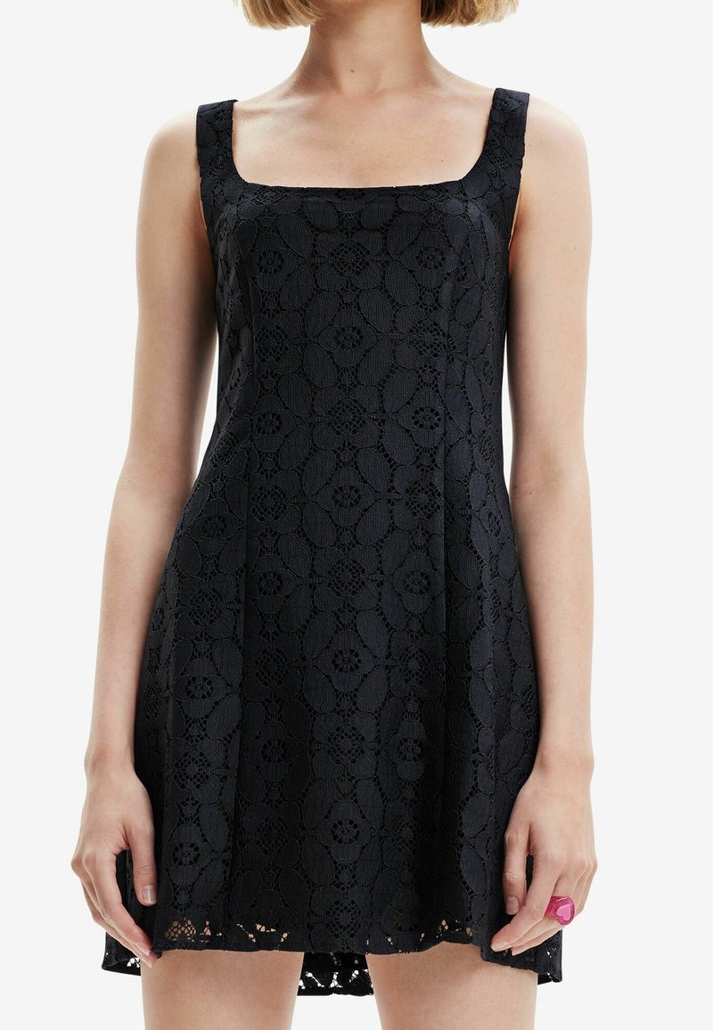 Black sleeveless dress with a square neckline, crafted from textured lace featuring floral patterns and a flared hem.