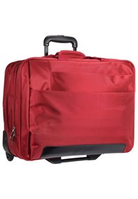 Red polyester rolling suitcase with a retractable black handle, zippered compartments, and a solid black base for stability.