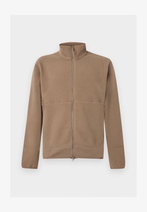 Beige fleecejakke med fuld lynlås, stående krave, lange ærmer og struktureret stof, vist på en hvid baggrund.