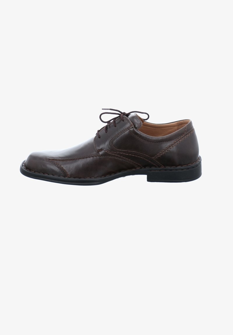 Bruine leren geklede schoenen met een gladde afwerking, ronde neus, vetersluiting, gestikte accenten en een lichte hak. Zwarte rubberen loopzool.