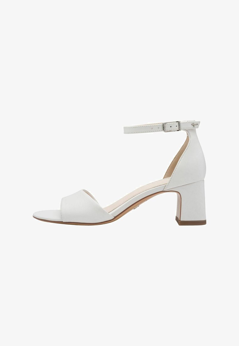 White heeled sandal featuring an open toe, ankle strap with buckle, and a block heel. Smooth leather material with a minimalistic design.