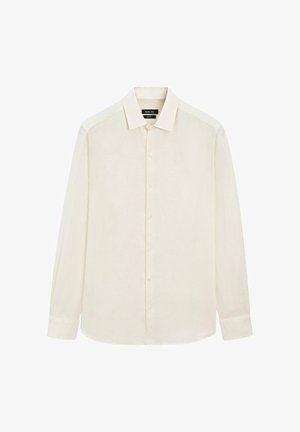 Chemise à manches longues couleur crème avec un col classique, des boutons visibles sur le devant et un ourlet légèrement arrondi.