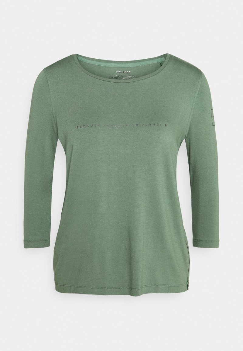 Haut vert à manches longues en tissu doux, avec un col rond et un motif texte sur le devant. Des fentes latérales ajoutent un détail au design.