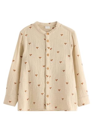 Beige Hemd mit langen Ärmeln, aus strukturiertem Stoff mit wiederholtem Fuchs-Muster in Braun und Weiß. Holzknöpfe auf der Vorderseite.