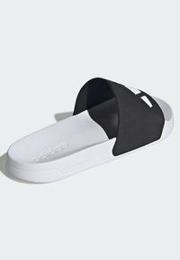 Black slide sandal featuring a wide strap and white rubber sole. The sole has a textured finish, and "cloudfoam" is embossed on the side.