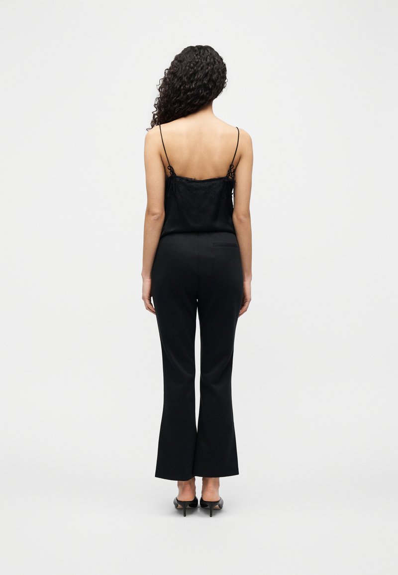 Calvin Klein SPACER FIT FLARE PANT - Kalhoty - black