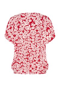 Blouse à fleurs rouges avec une coupe ample, des manches courtes, un col rond et un motif de fleurs blanches répétitif sur l'ensemble.