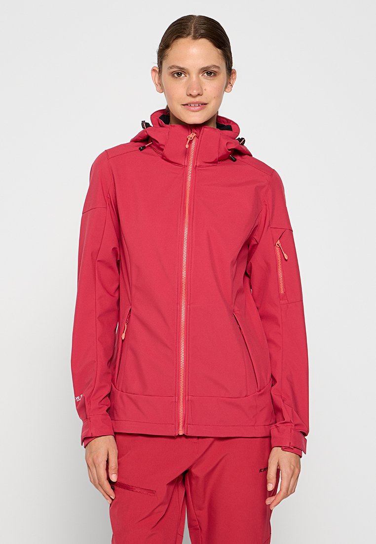 Rote Softshelljacke mit hohem Kragen, Frontreißverschluss und zwei Seitentaschen. Verfügt über elastische Bündchen und eine Reißverschlusstasche am Ärmel.