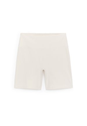 Lichtbeige fietsshorts van rekbare stof, met een hoge tailleband en een glad, aansluitend ontwerp zonder zichtbare hardware.
